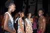 T12 (484Wx324H) - (from left) Renae Ellis, Angena Thomas and Rosina Casserly converse with a dancer 